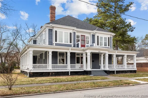 a view of a big yard in front of a house