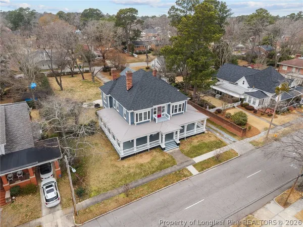 an aerial view of houses with yard