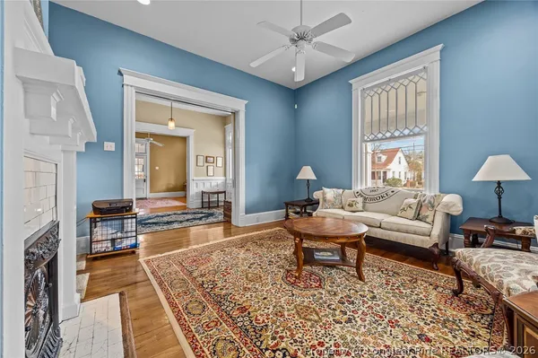 a living room with furniture and a fireplace