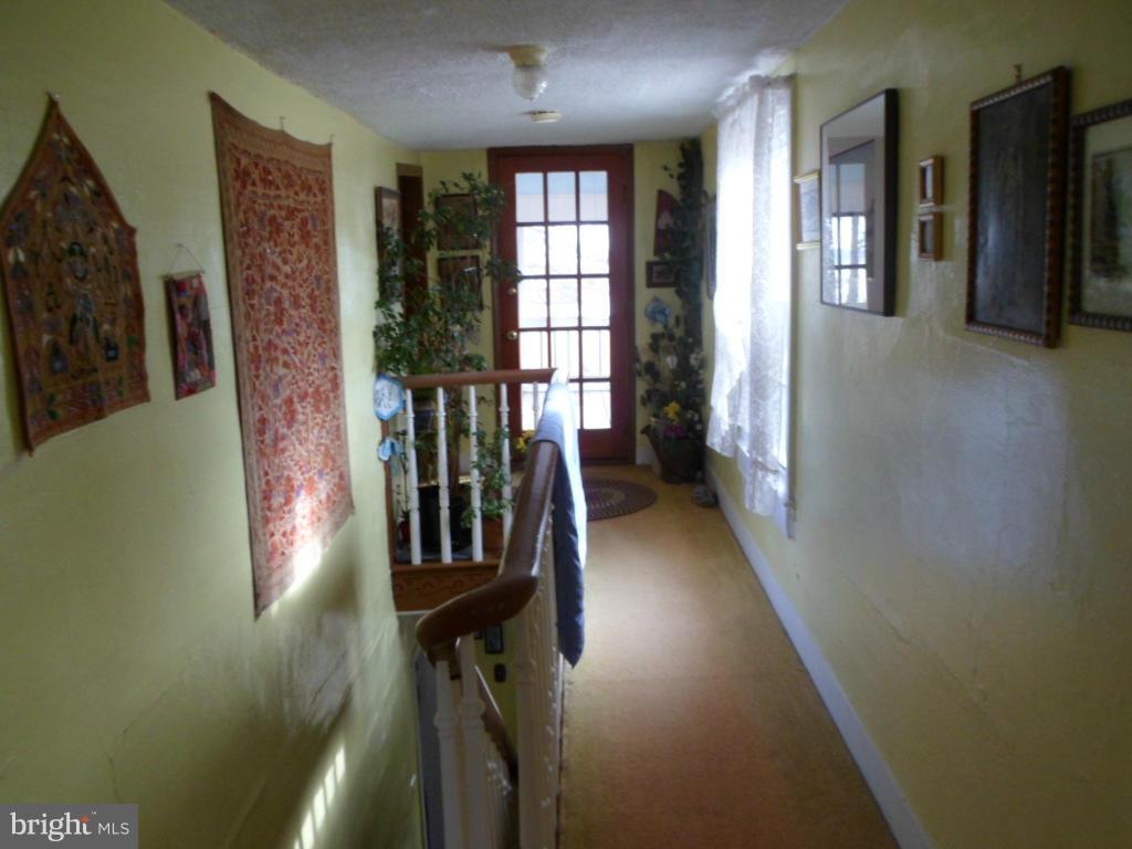16712 Piney Point Road Piney Point, MD 20674 - Photo 24 of 29 a view of entryway and hall with wooden floor