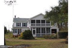 16712 Piney Point Road Piney Point, MD 20674 - Photo 5 of 29 a front view of a house with a garden