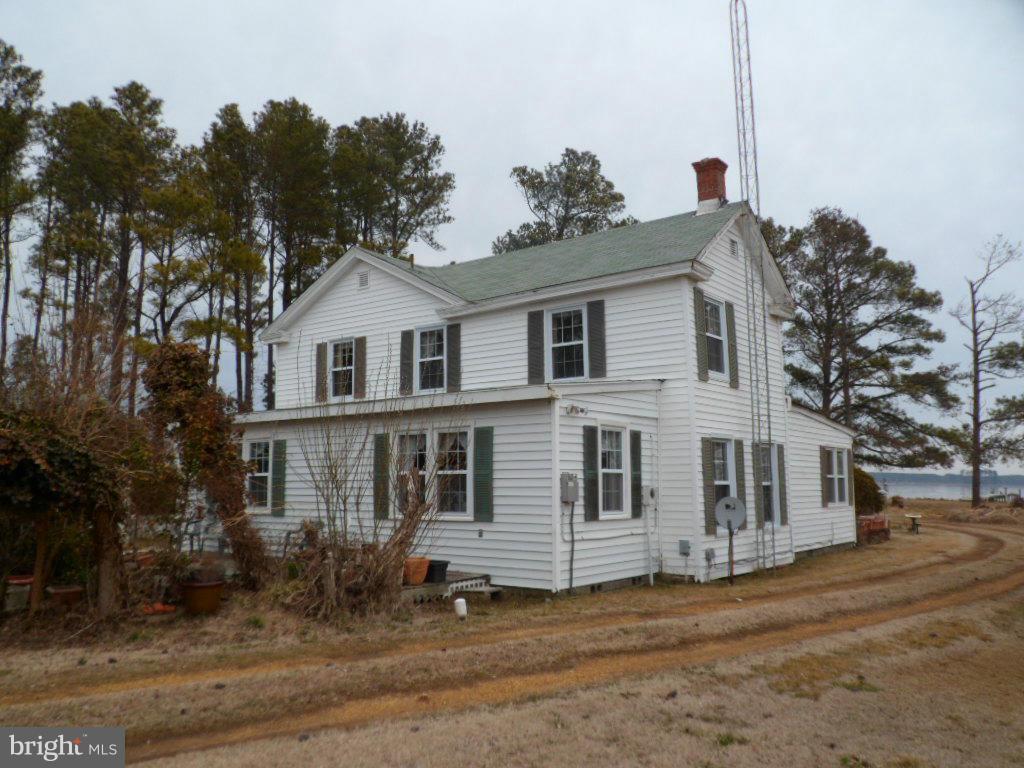 16712 Piney Point Road Piney Point, MD 20674 - Photo 8 of 29 a front view of a house with a garden