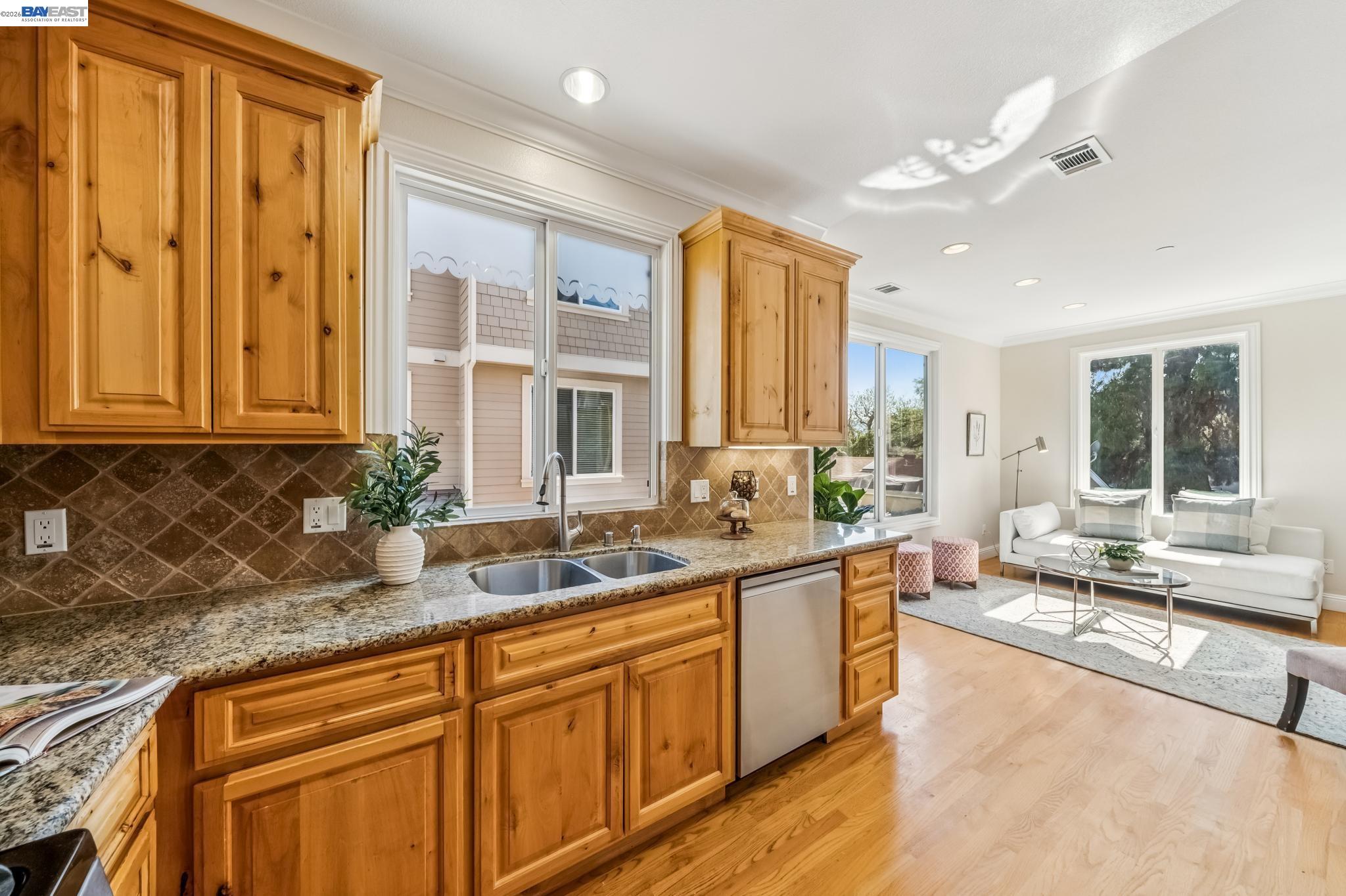 829 Lippert Place Santa Clara, CA 95050 - Photo 15 of 34 a large kitchen with stainless steel appliances granite countertop a sink and cabinets