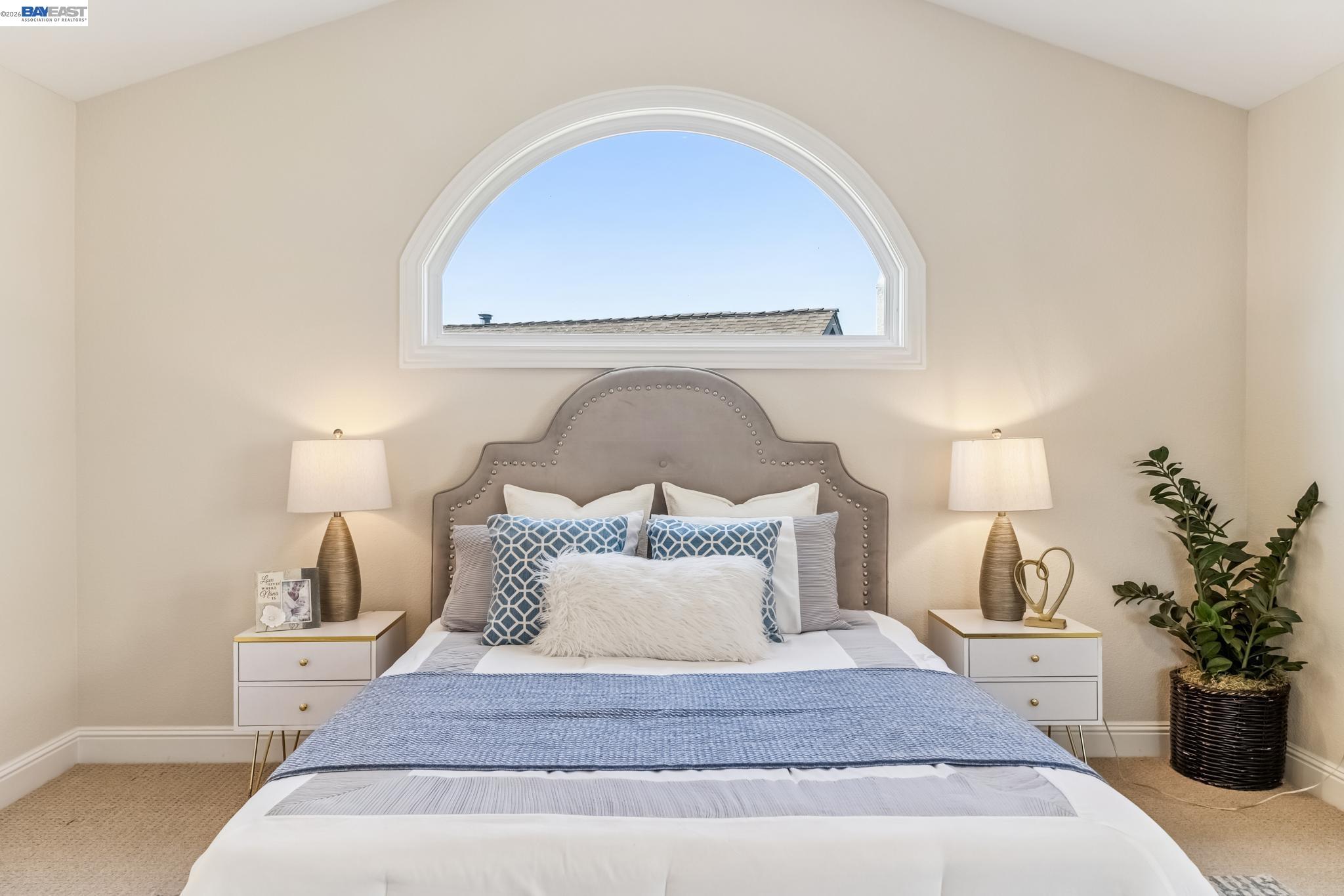 829 Lippert Place Santa Clara, CA 95050 - Photo 19 of 34 a spacious bedroom with a bed and a potted plant
