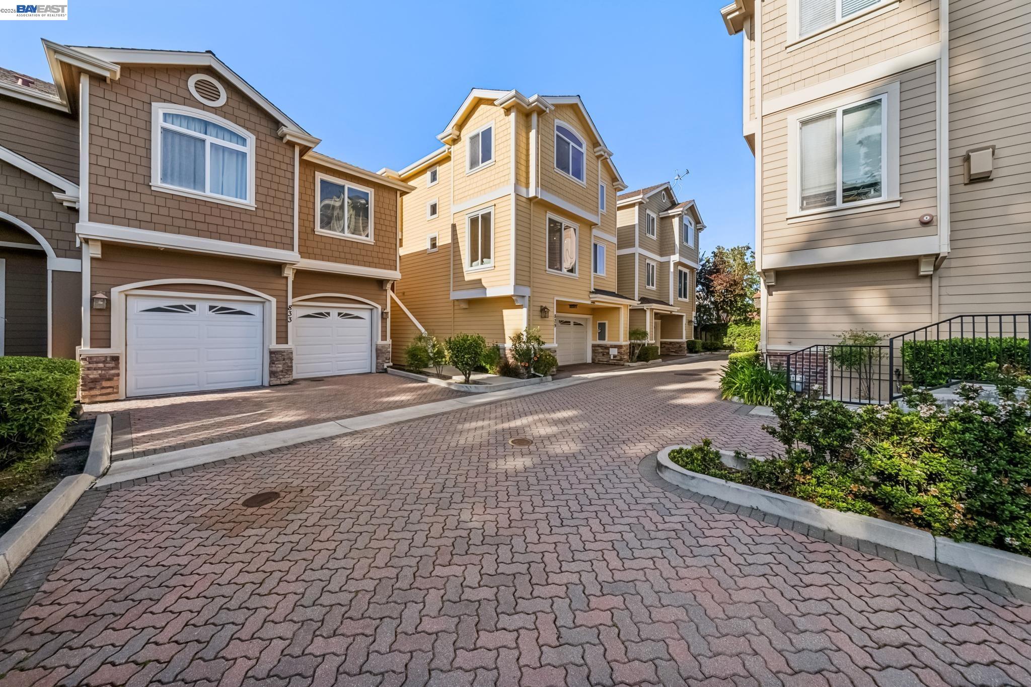 829 Lippert Place Santa Clara, CA 95050 - Photo 2 of 34 a front view of a house with a yard and a garage