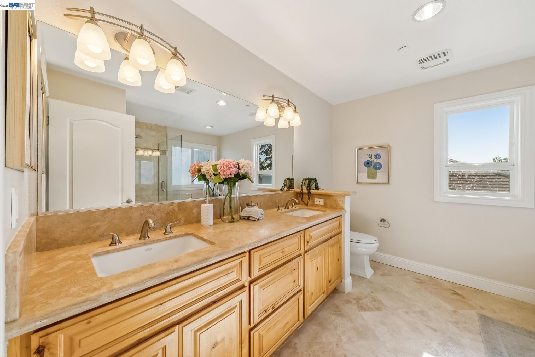 829 Lippert Place Santa Clara, CA 95050 - Photo 22 of 34 a bathroom with a granite countertop sink mirror and a toilet