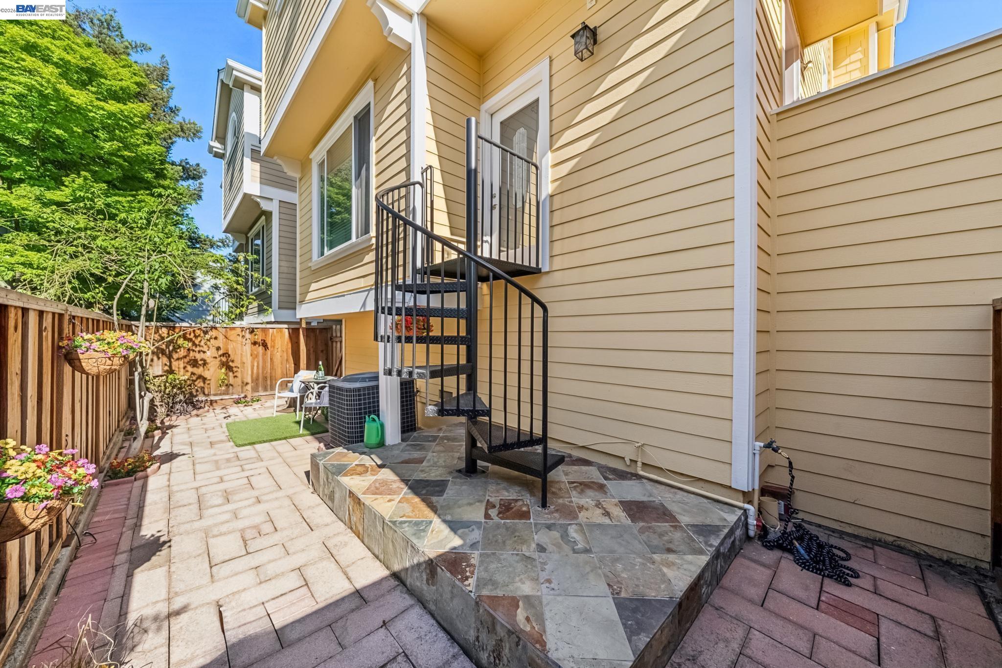 829 Lippert Place Santa Clara, CA 95050 - Photo 30 of 34 a view of a patio with a table and chairs and wooden fence