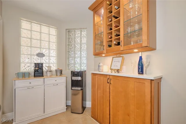 a kitchen with a refrigerator and window