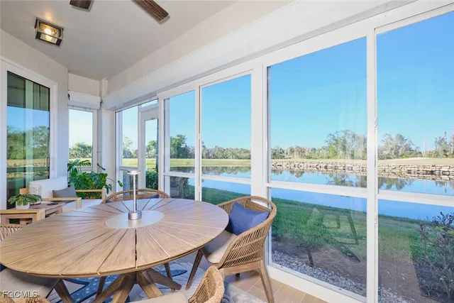 a view of a dining room with furniture window and outside view