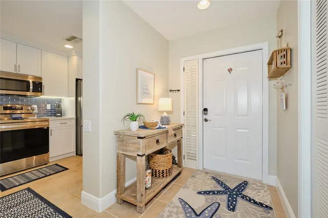 a view of kitchen with sink stove and refrigerator
