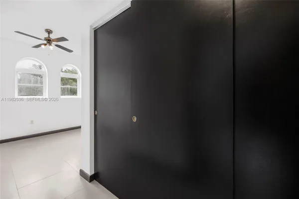 a view of a hallway with windows