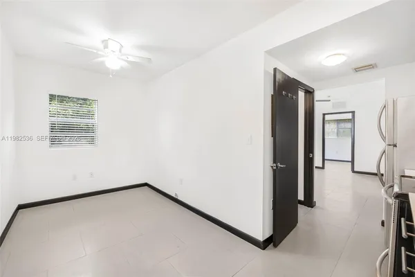 a view of a room with a ceiling fan