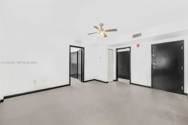 a view of empty room with closet