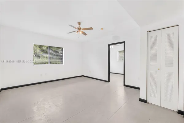 a view of a room with a large window