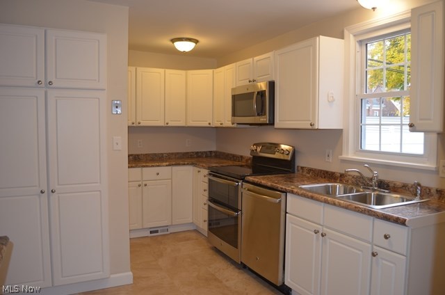 3726 Strandhill Road Shaker Heights, OH 44122 - Photo 12 of 31 Fantastic remodeled kitchen with granite counters, stainless appliances, and white cabinets.