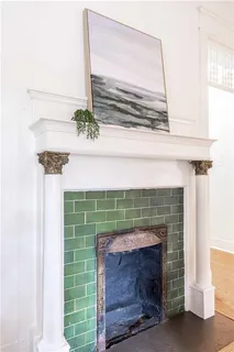 a dining room with furniture and a potted plant