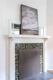 a kitchen with a stove and white cabinets