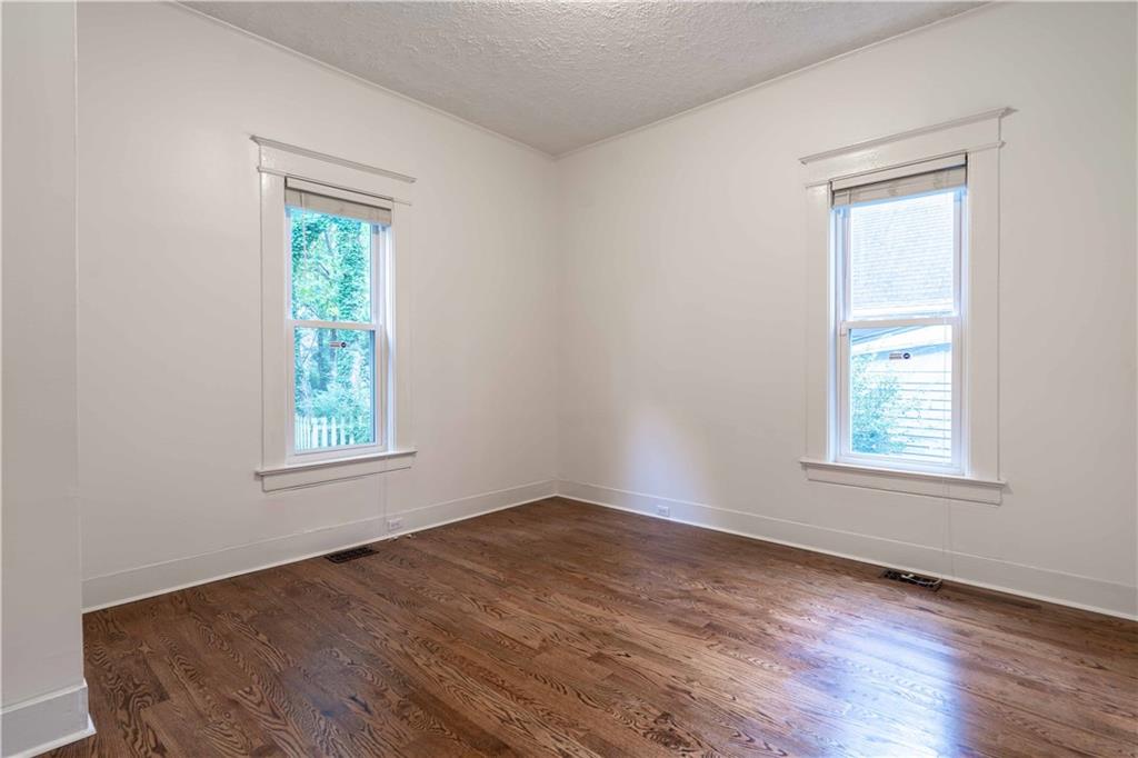 680 Grady Place Southwest Atlanta, GA 30310 - Photo 24 of 54 an empty room with wooden floor and a window