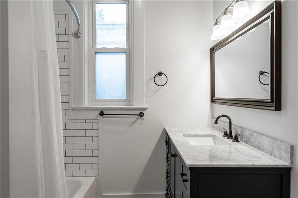 680 Grady Place Southwest Atlanta, GA 30310 - Photo 26 of 54 a bathroom with a sink and a mirror