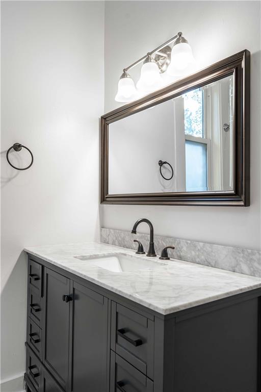 680 Grady Place Southwest Atlanta, GA 30310 - Photo 27 of 54 a bathroom with a sink and a mirror