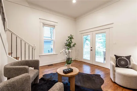 a view of entryway dining room and hall with wooden floor