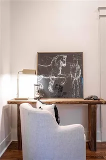 a spacious bedroom with a bed and a chandelier