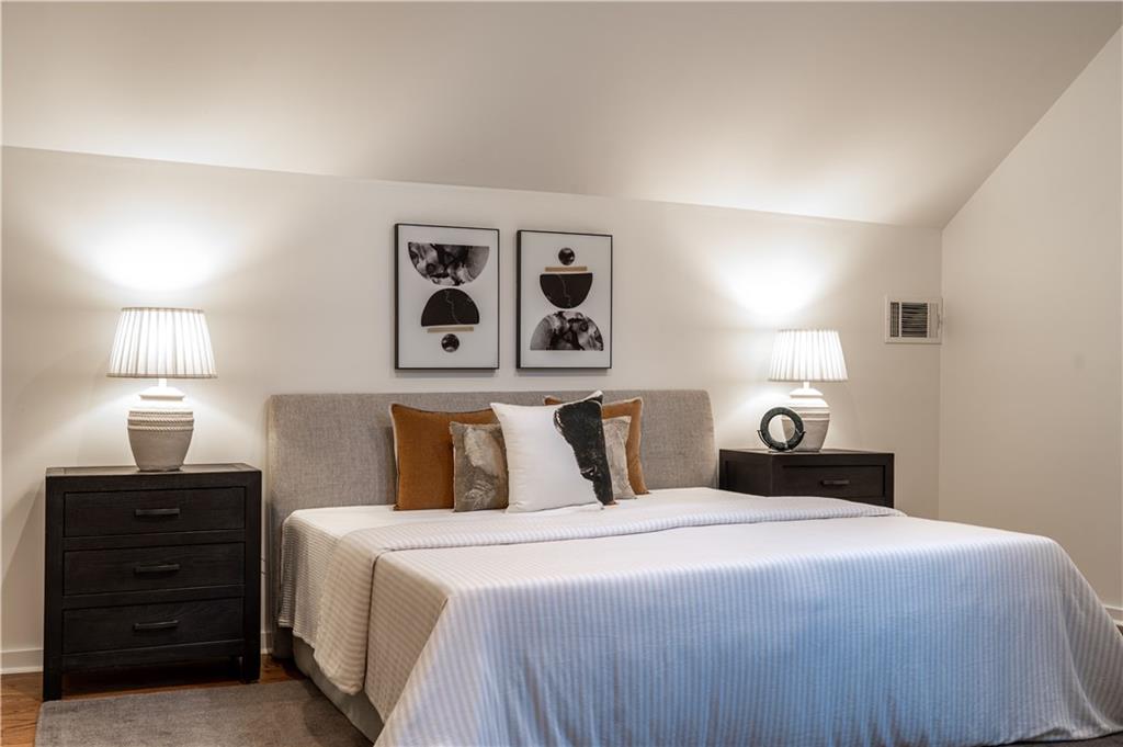 680 Grady Place Southwest Atlanta, GA 30310 - Photo 36 of 54 a bedroom with a bed and painting on the wall