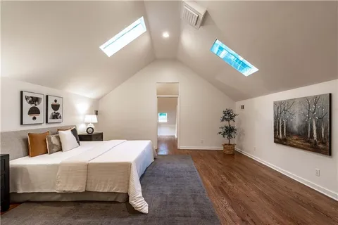 a bathroom with a white bathtub and a shower