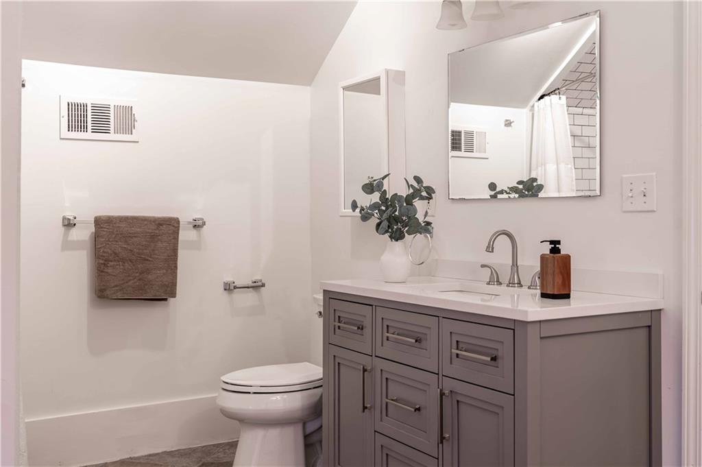 680 Grady Place Southwest Atlanta, GA 30310 - Photo 40 of 54 a bathroom with a sink toilet and a mirror