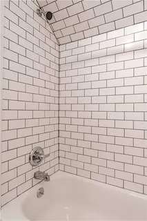 an empty room with wooden floor and closet