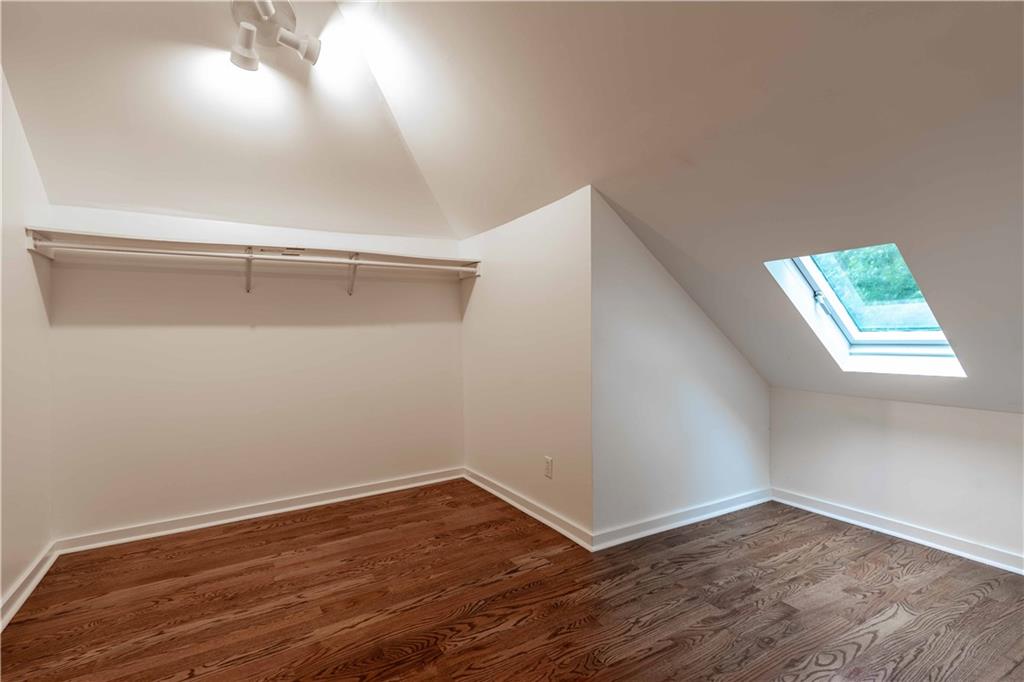 680 Grady Place Southwest Atlanta, GA 30310 - Photo 44 of 54 a view of an empty room with wooden floor and a window