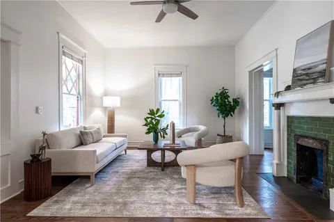 a living room with furniture and a fireplace