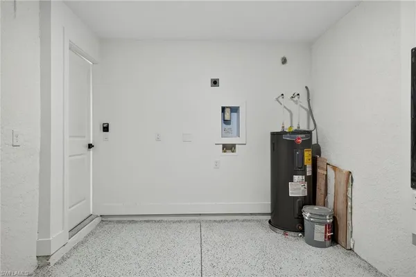 a view of hallway with a white door