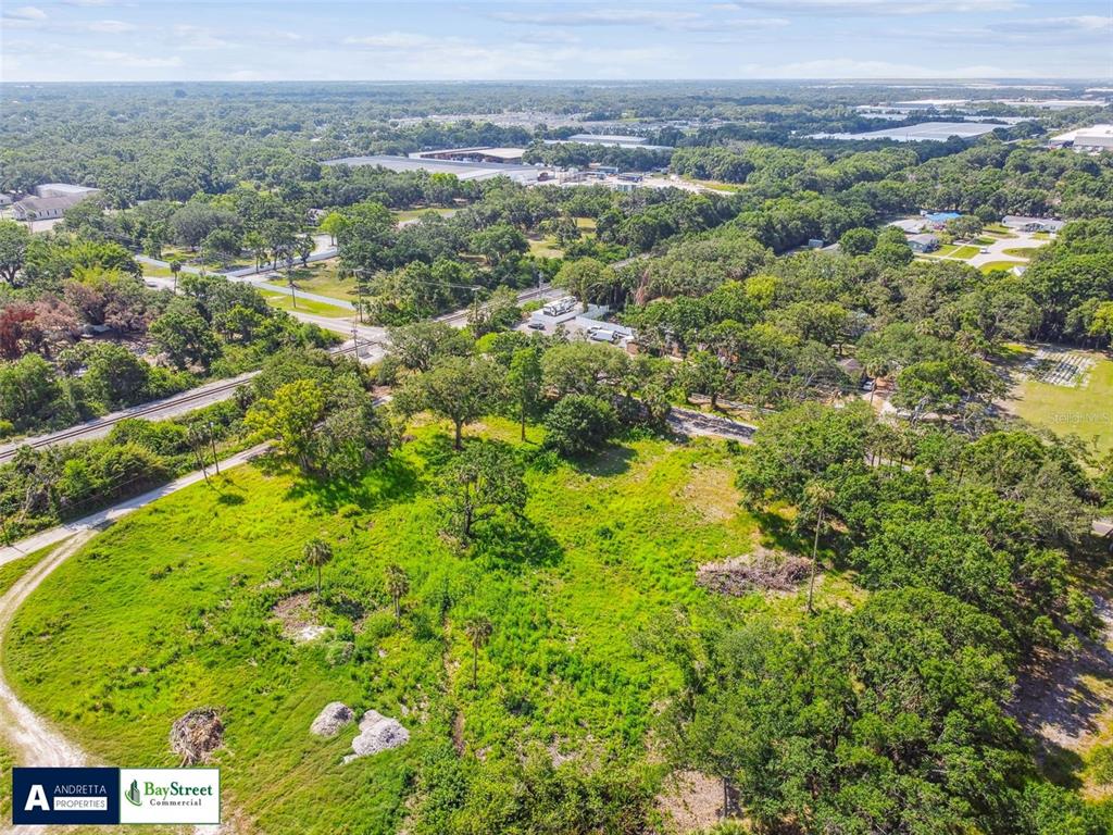 5116 Palm River Road Tampa, FL 33619 - Photo 10 of 10 a view of a city with lush green forest