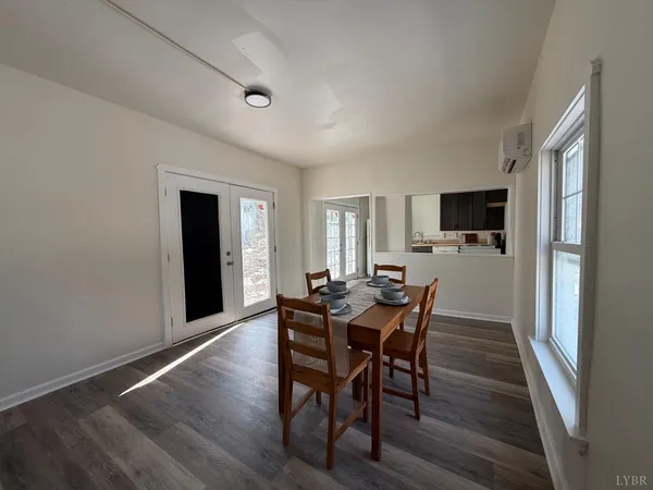 a kitchen with a refrigerator stove and wooden cabinets