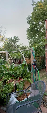 a view of a backyard with sitting area