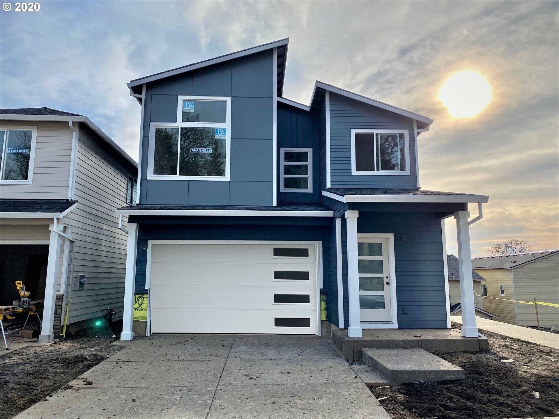 a front view of a house with a garage