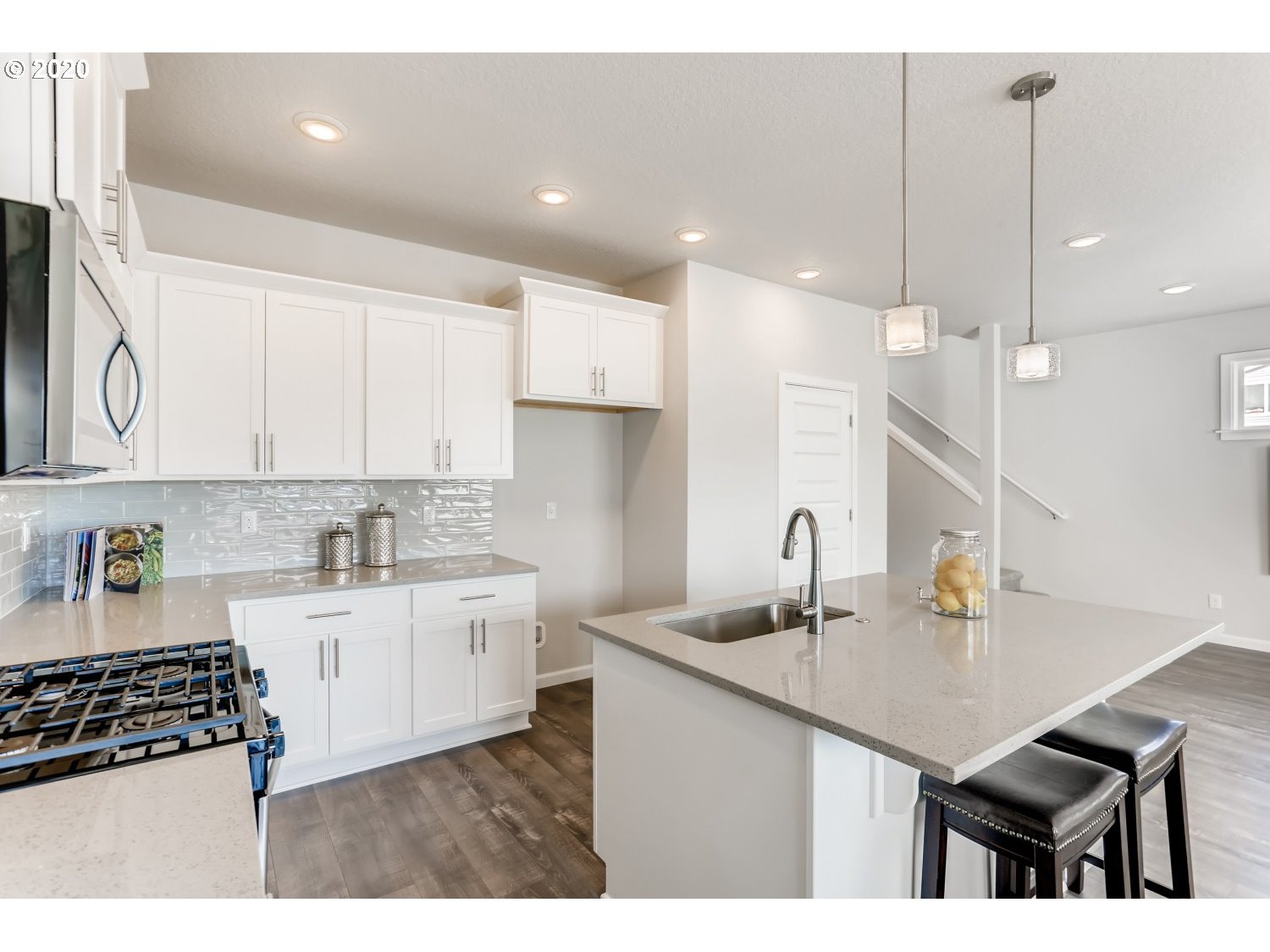 1550 19th Avenue Forest Grove, OR 97116 - Photo 13 of 26 a kitchen with a sink a stove a refrigerator and cabinets