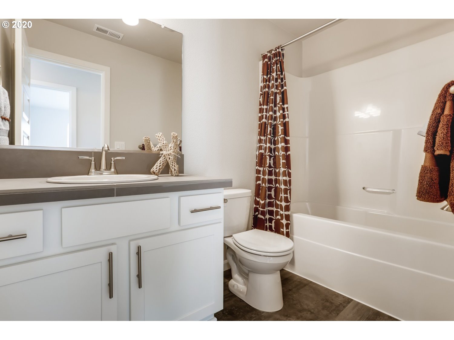 1550 19th Avenue Forest Grove, OR 97116 - Photo 19 of 26 a bathroom with a sink a toilet and a bathtub