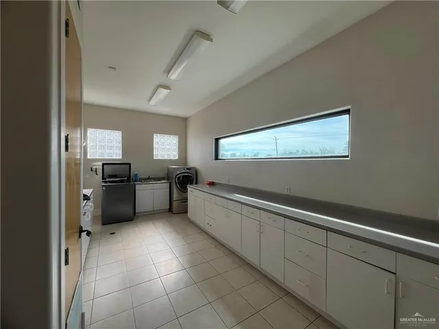 a kitchen with a refrigerator and a sink