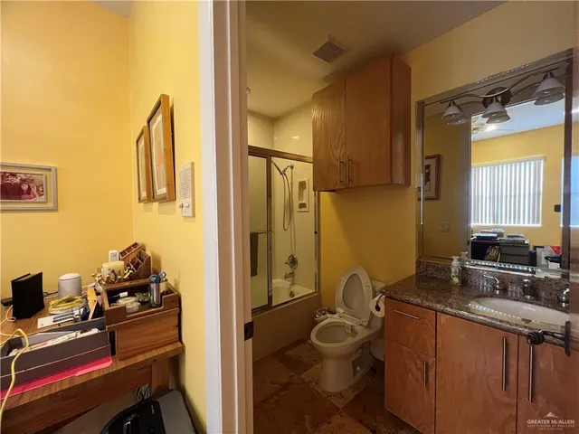 a spacious bedroom with two beds and a couch