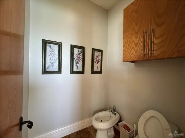 a living room with furniture tv and a large window