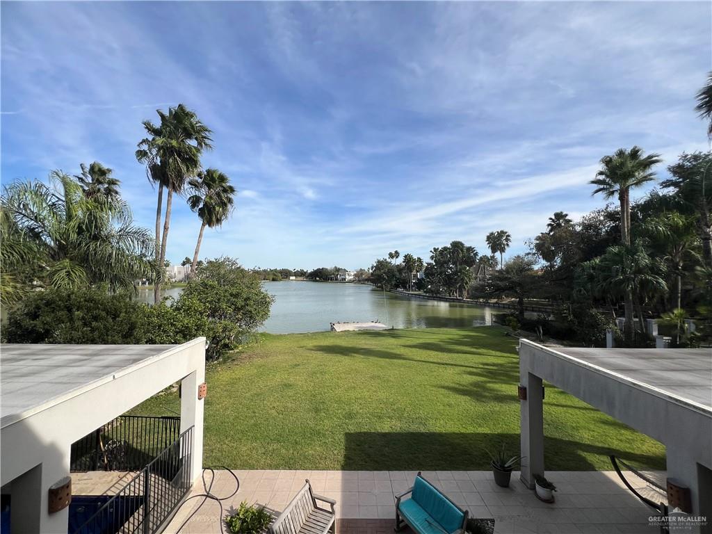 416 Frio Street Mission, TX 78572 - Photo 28 of 35 a view of a lake with a bench in front of it