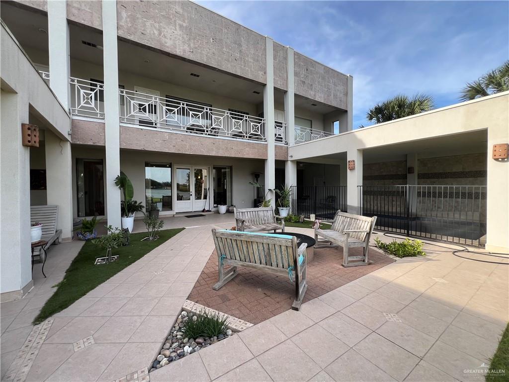 416 Frio Street Mission, TX 78572 - Photo 35 of 35 a view of the patio with a table and chairs and potted plants