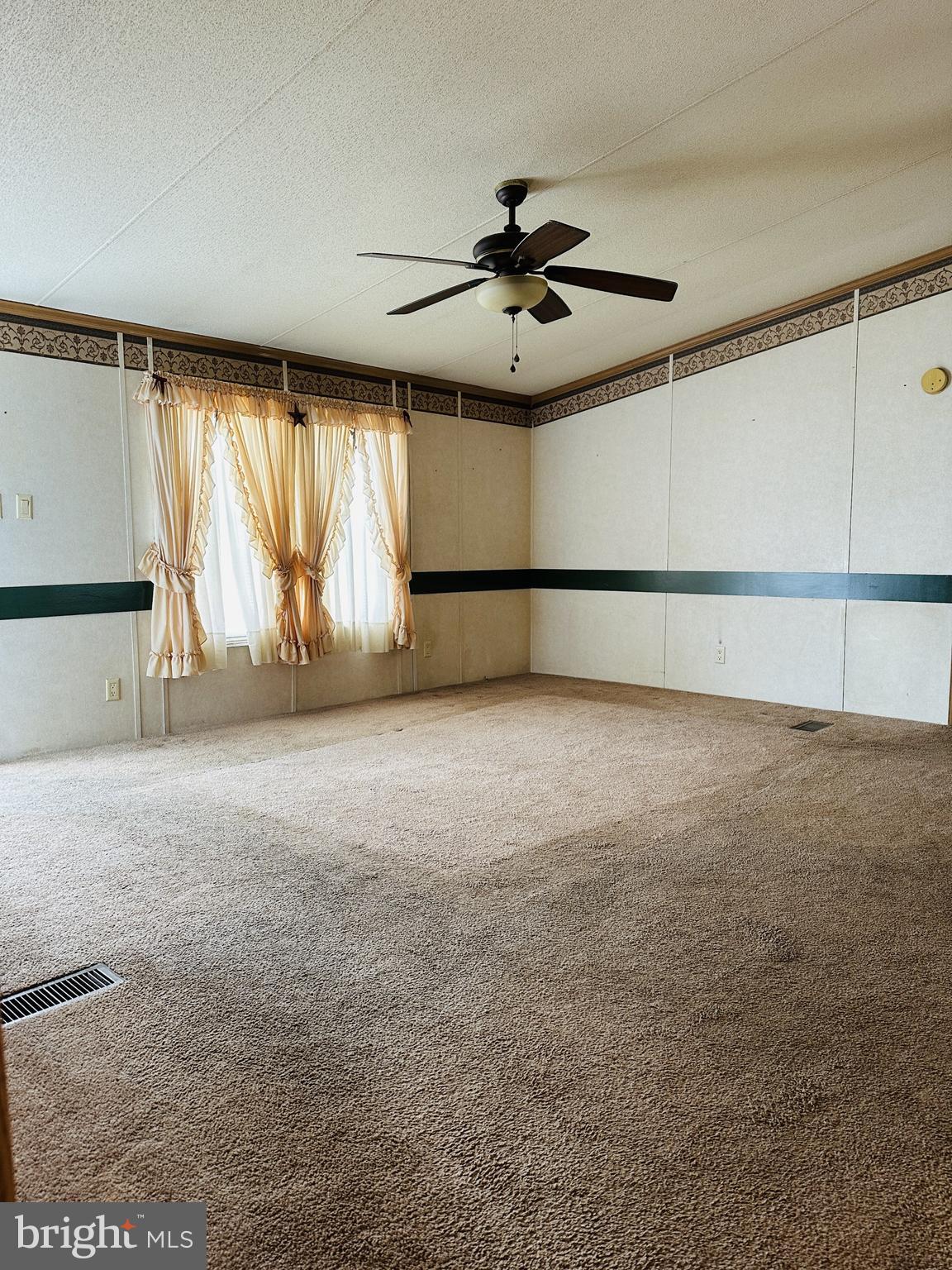 16935 Alcott Road Hagerstown, MD 21740 - Photo 4 of 9 a view of an empty room with a window