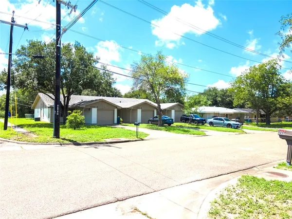 a view of a playground with basketball court
