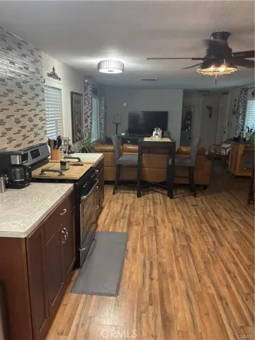 a kitchen with sink a counter and cabinets