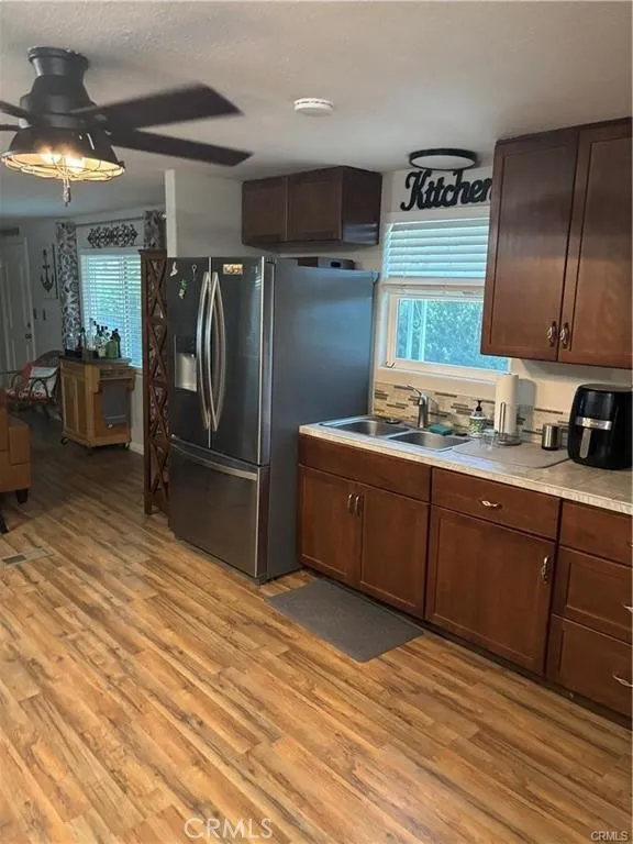 670 Channel Needles, CA 92363 - Photo 3 of 19 a kitchen with stainless steel appliances granite countertop a refrigerator a stove and a sink