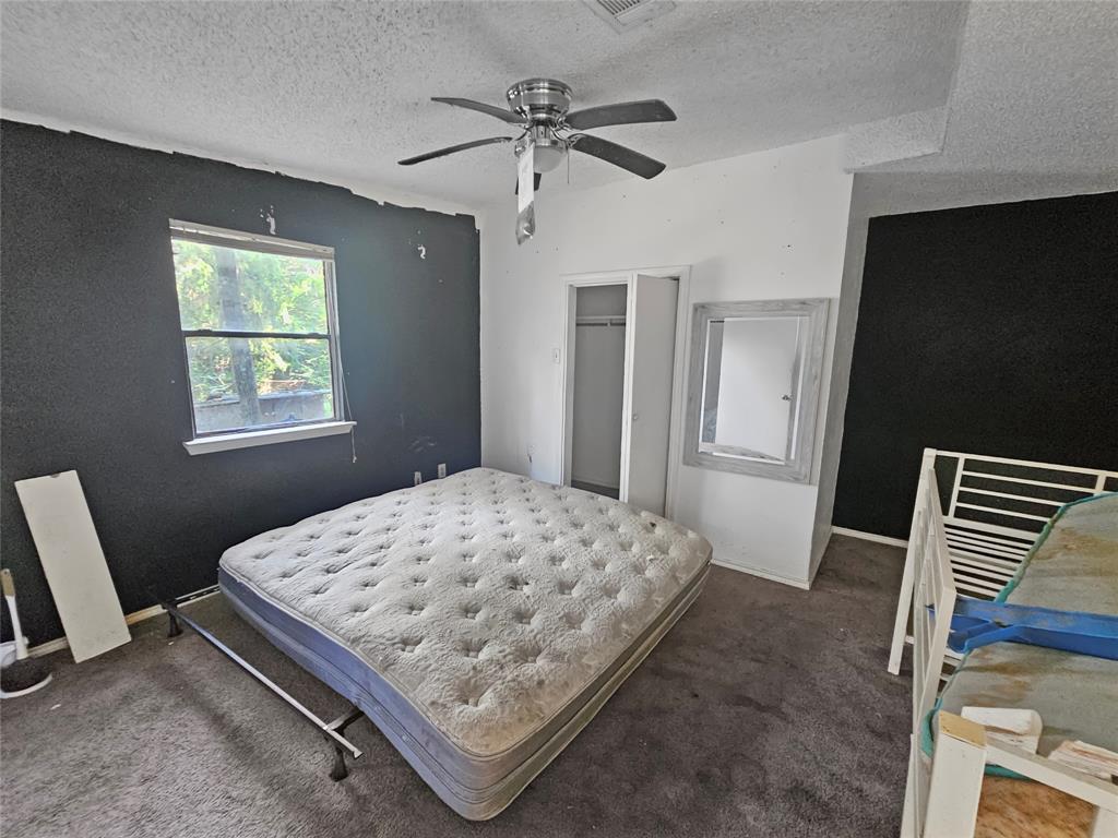 709 Cedarcrest Drive Tool, TX 75143 - Photo 11 of 15 a bedroom with a bed and a window