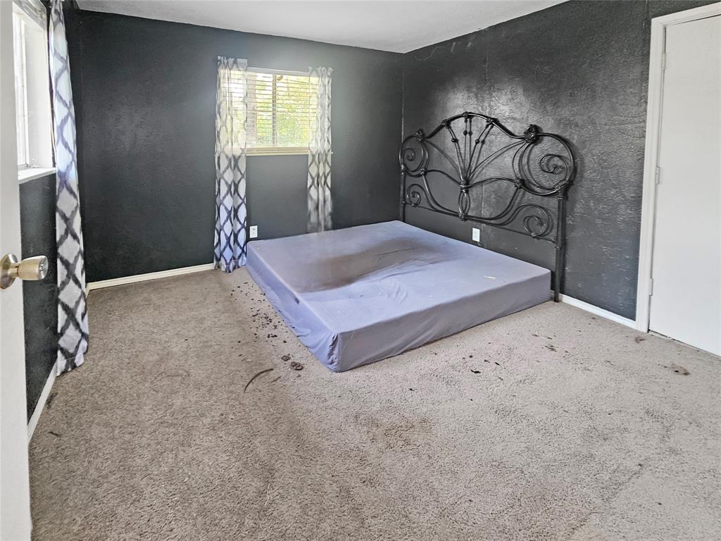 709 Cedarcrest Drive Tool, TX 75143 - Photo 15 of 15 a bedroom with a bed and a window